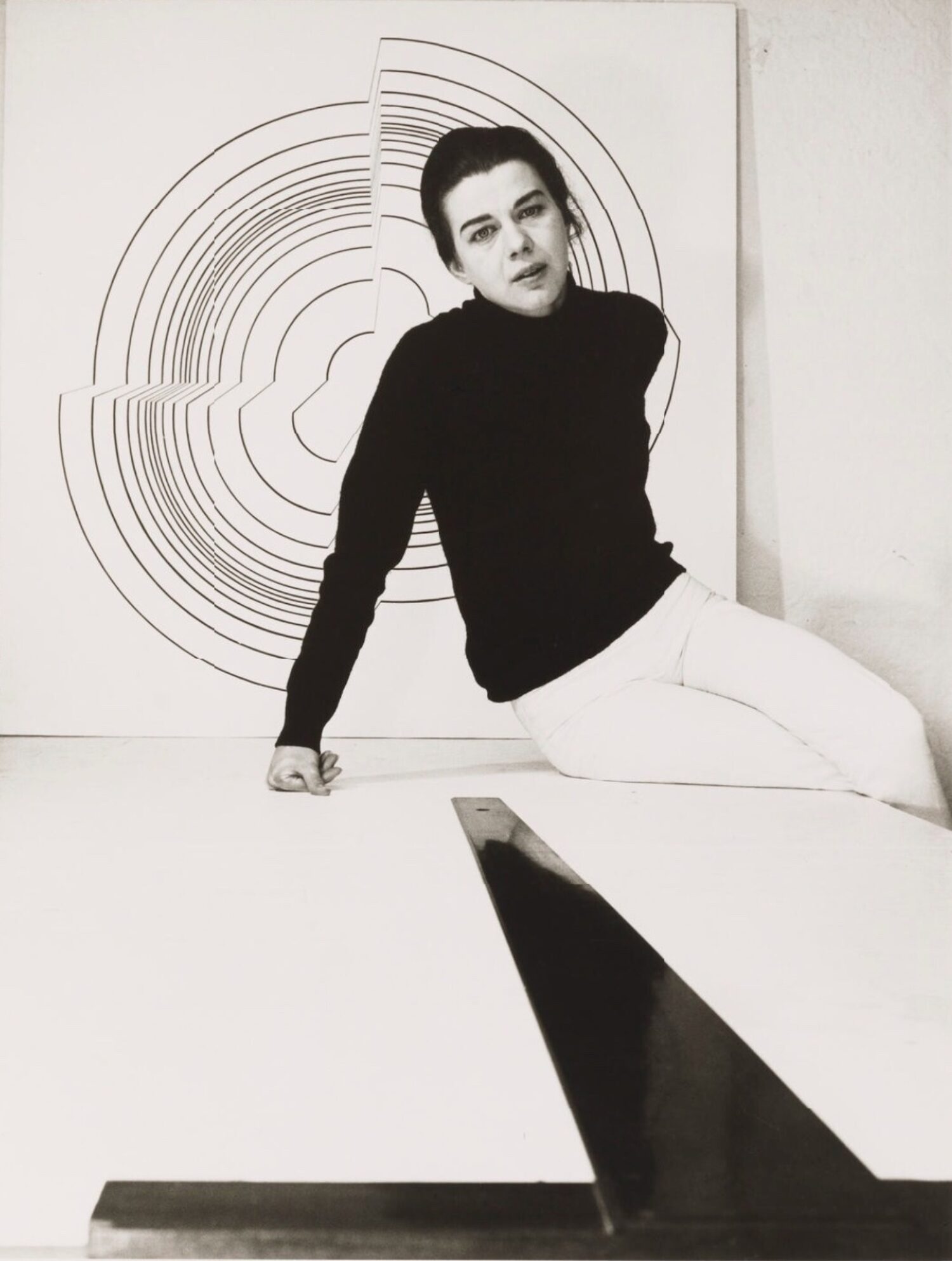 Bridget Riley photographed by J.S. Lewinski in her flat in Holland Park in 1964