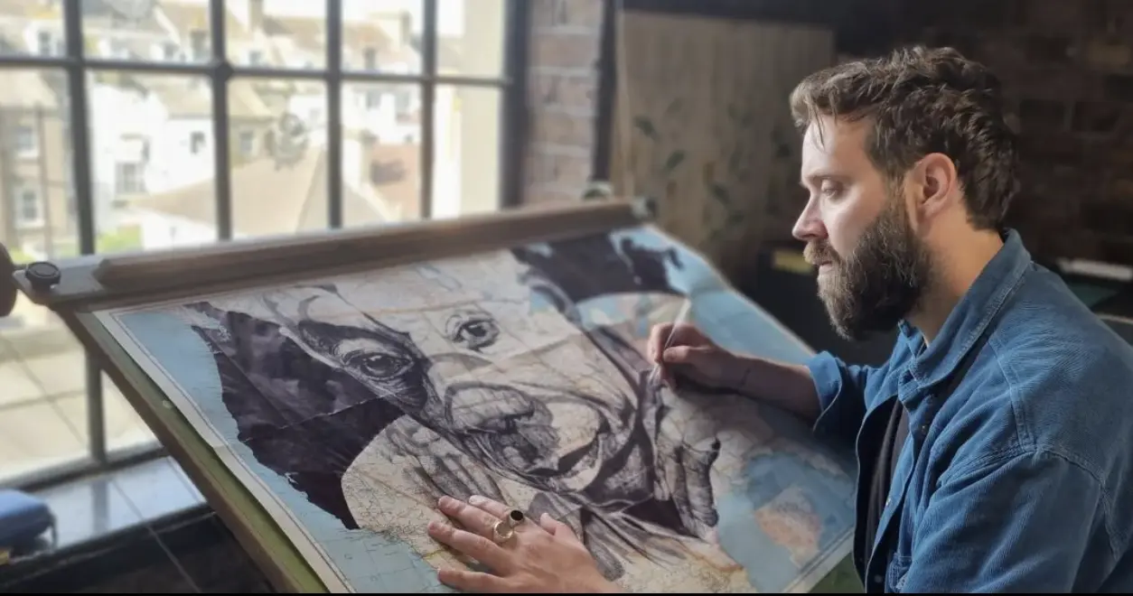 Mark Powell in his studio drawing James Baldwin