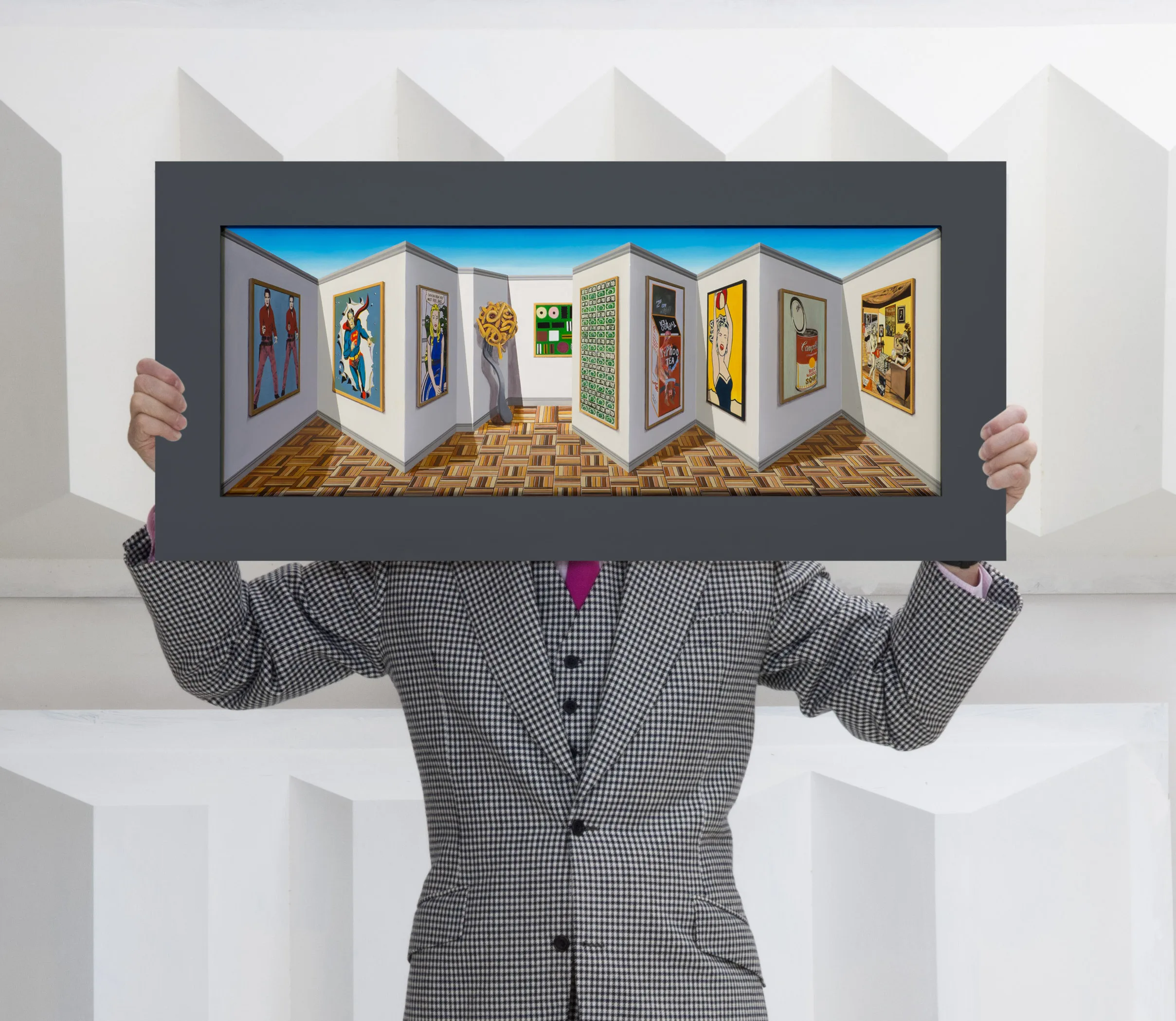 Patrick Hughes poses with his work