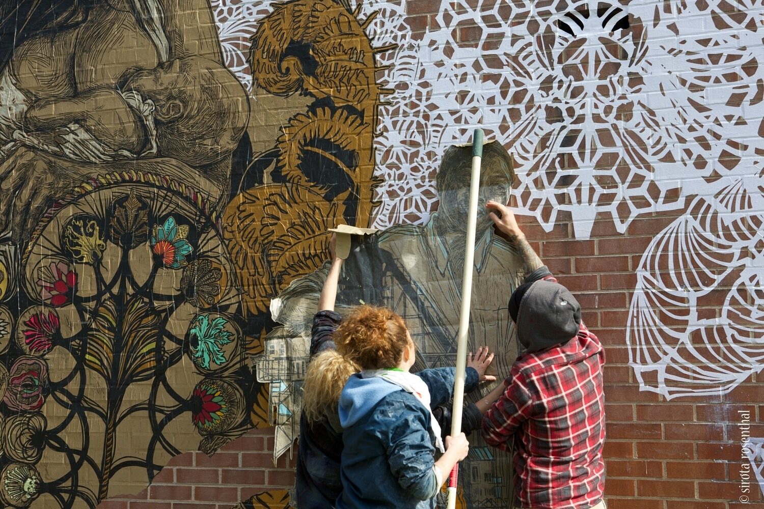 Swoon and her team working on 'Dawn and Gemma' mural in New Haven.