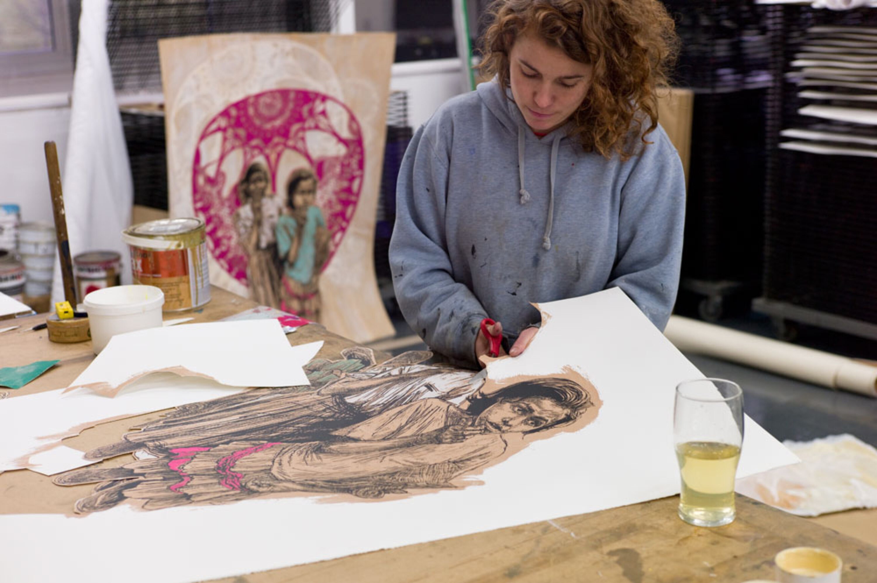 Swoon in the studio, working on 'Sambhavna'.