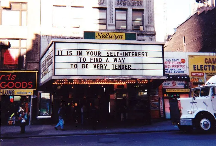 Image from Holzer's Marquee series, using selected “Truism” and “Survival” texts, NYC.