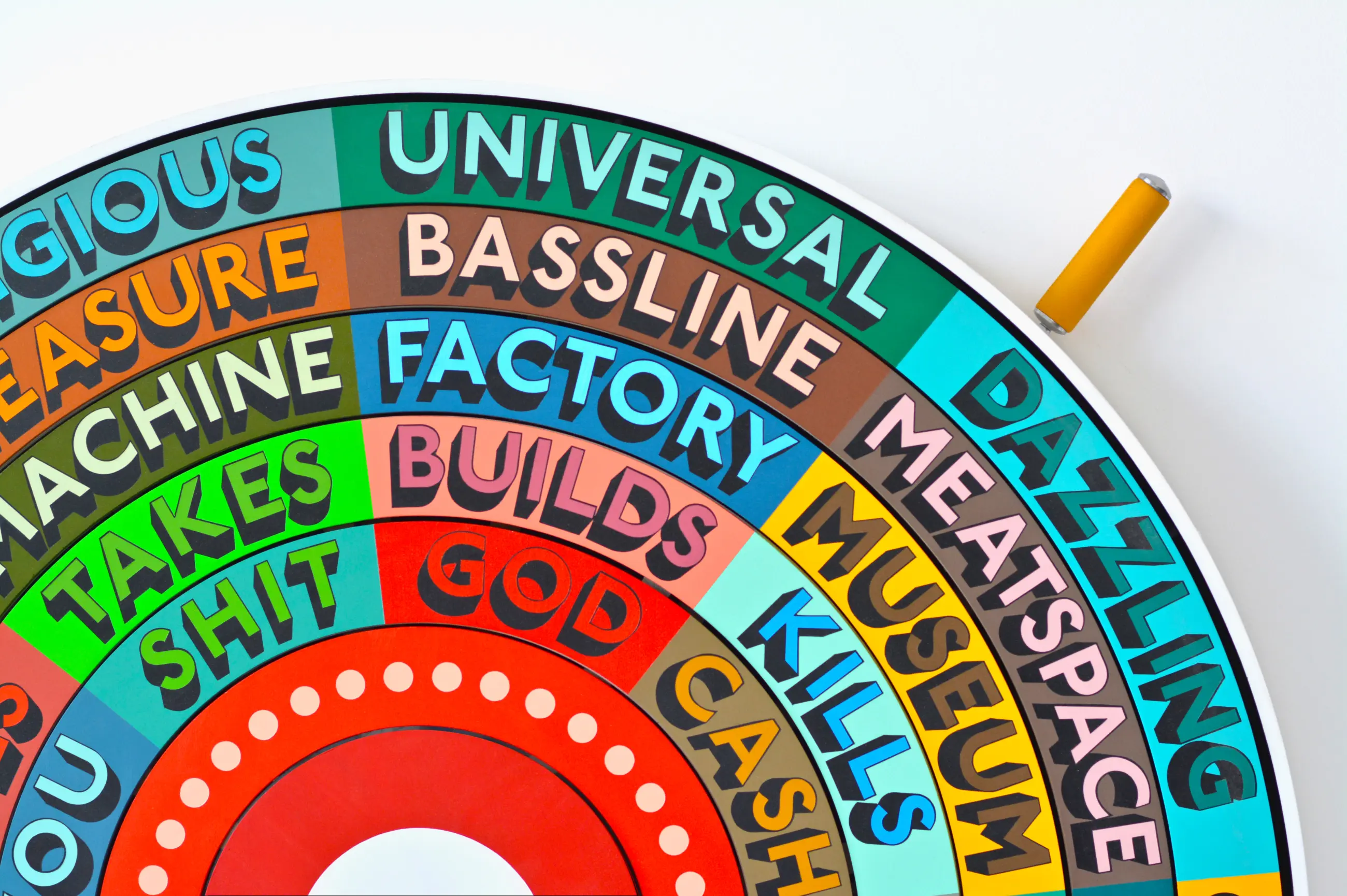 A rainbow-coloured wheel of fortune by artist Tim Fishlock that helps us to make random, dystopian poems