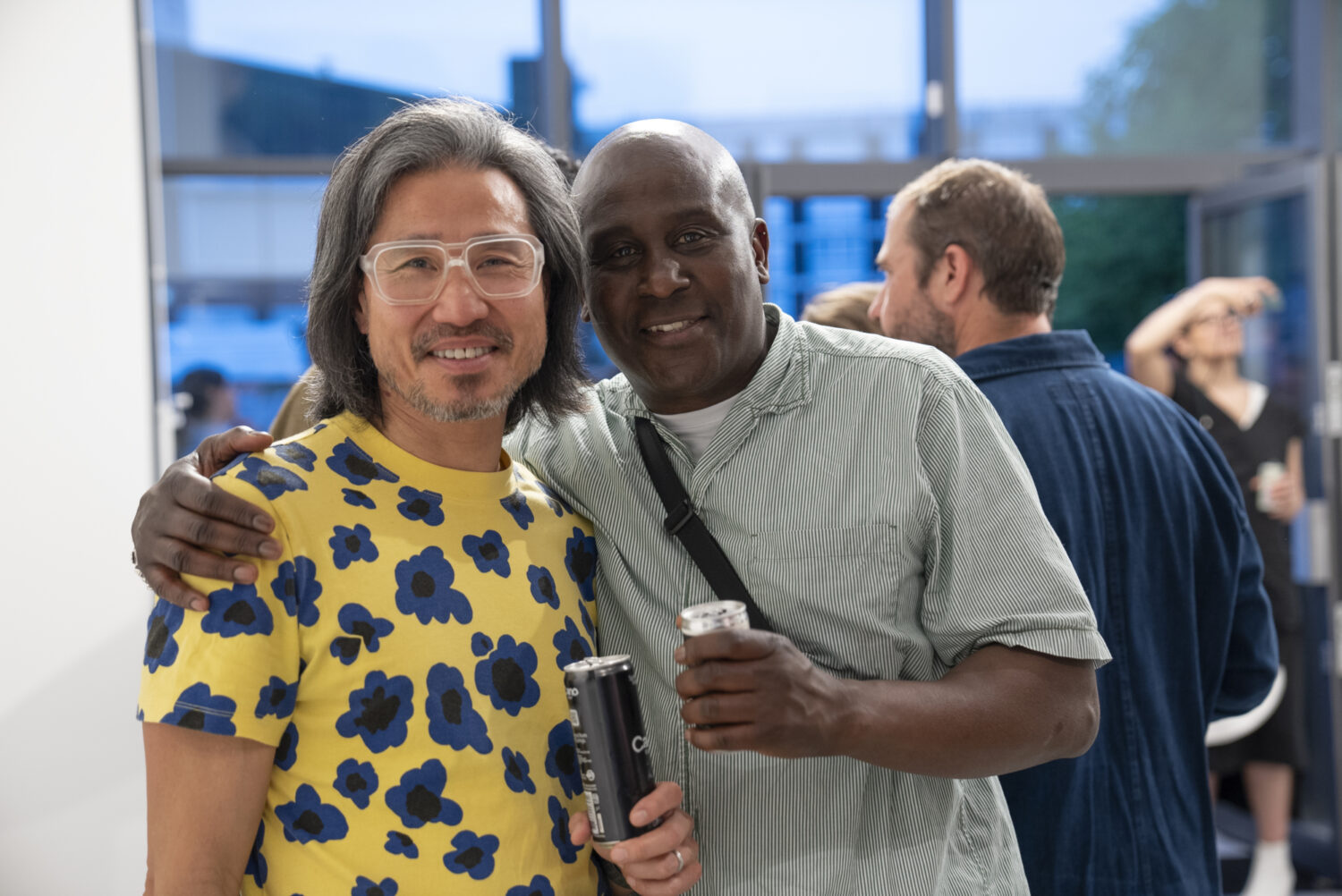 Guests connect and share laughs with Kostas during the lively private view