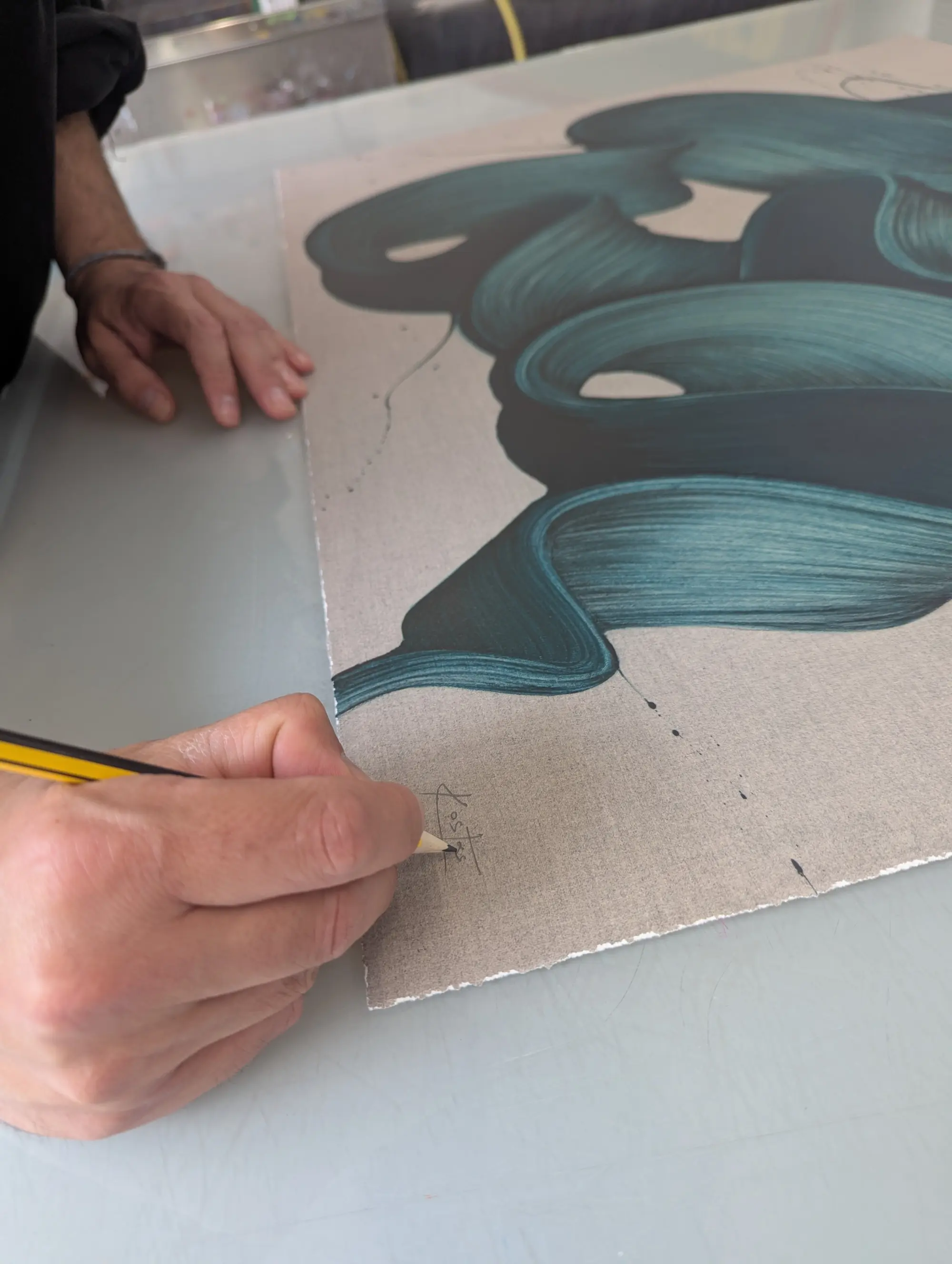 Kostas Papakostas signing the edition at Jealous Print Studio