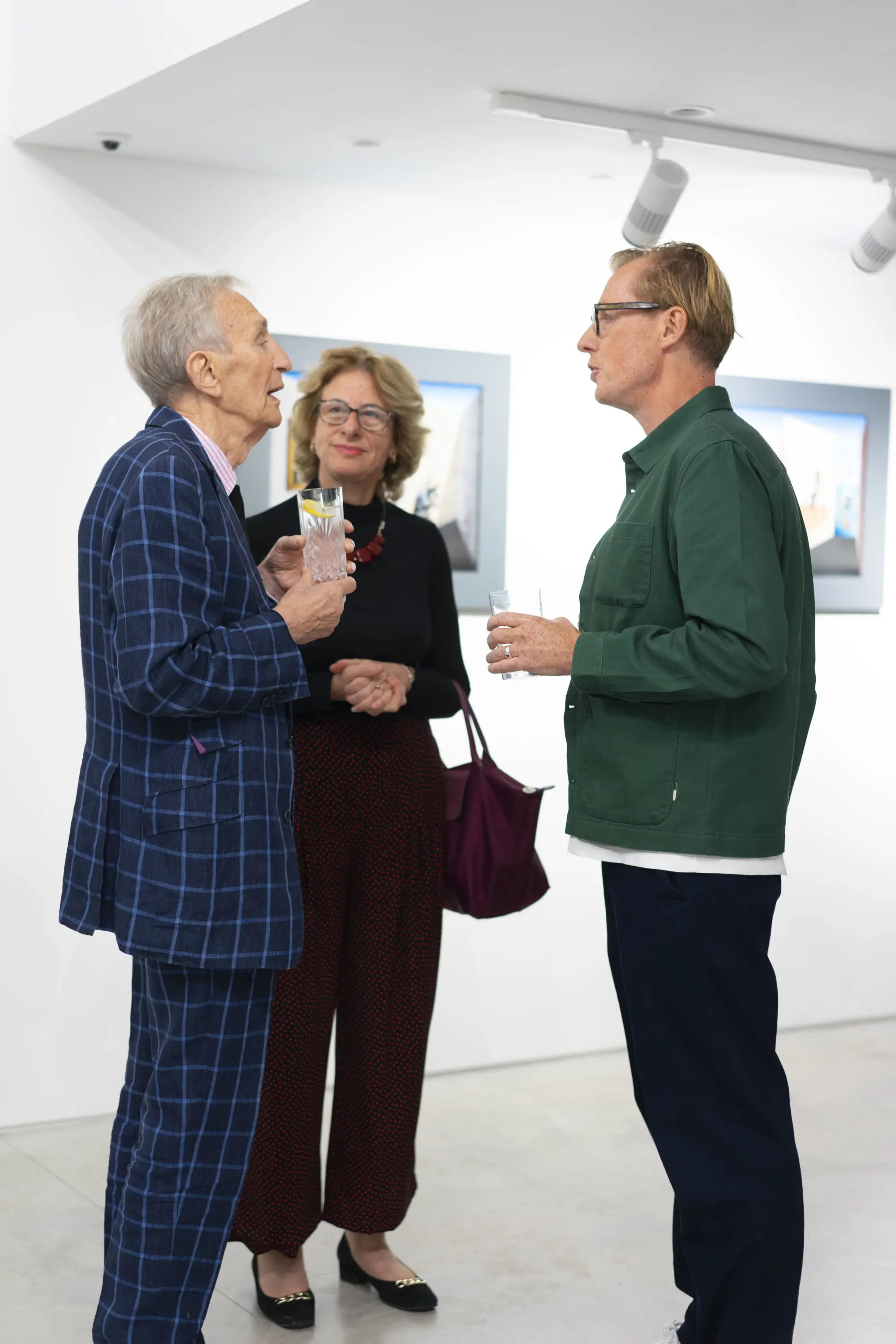 Director Ben Cotton speaking with artist Patrick Hughes at his exhibition, Hang-Up Gallery 2021.
