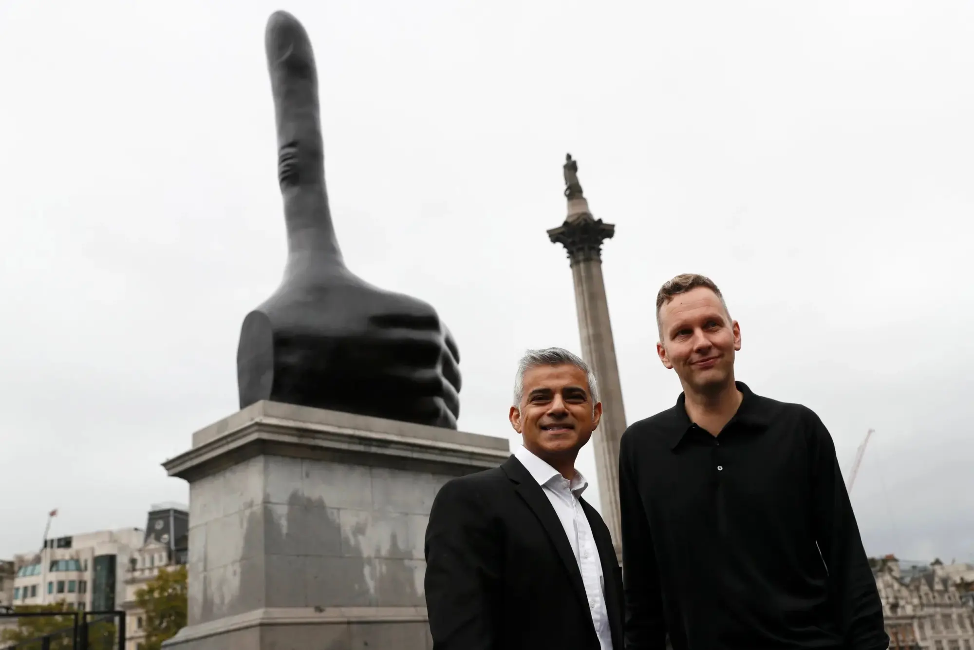 Mayor of London Sadiq Khan poses with artist David Shrigley at the unveiling of the sculpture in 2016