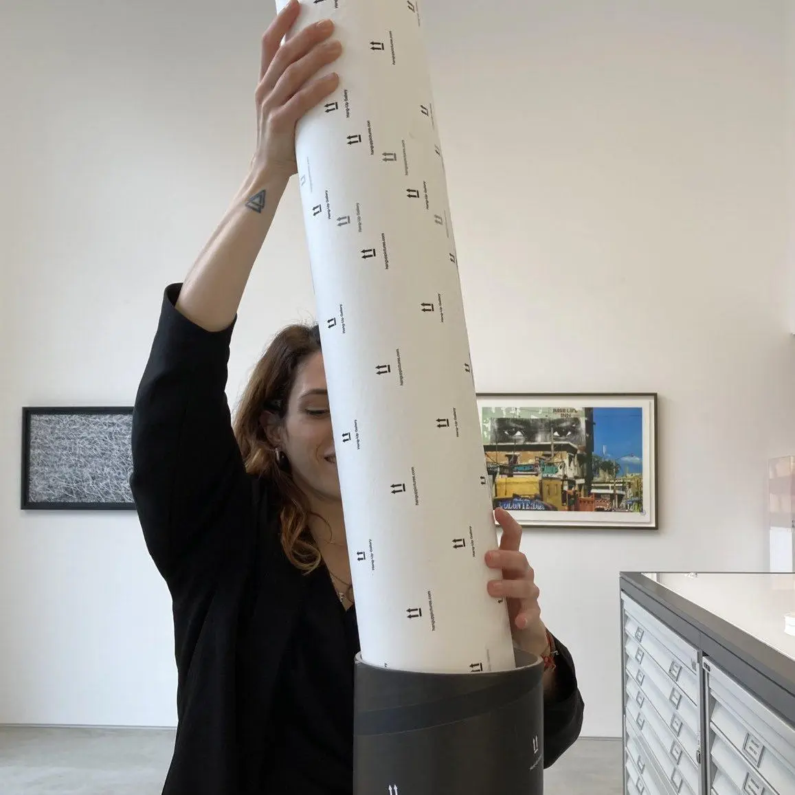 10. Put another piece of tissue paper or bubble wrap on top of your print inside the tube and seal the top of your tube with heavy duty tape.