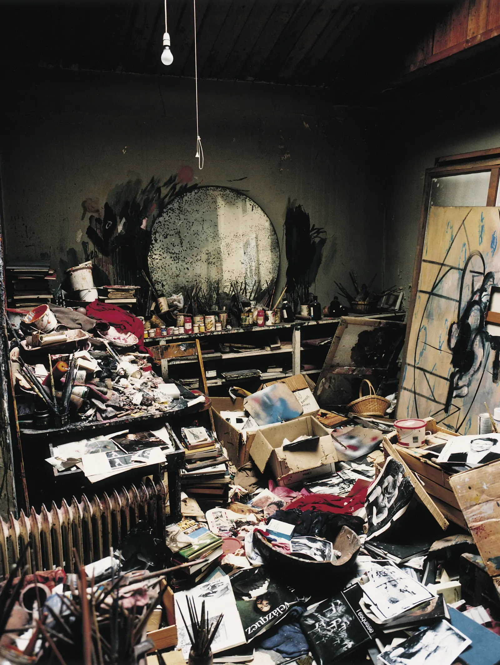 Francis Bacon's studio at 7 Reece Mews, London alongside Cristina Portolano's illustration. In 1998 Bacon's studio was donated to The Hugh Lane Gallery, Dublin. 7,000 objects were carefully packed and transported for the artist's studio to be reconstructed in archaeological detail.