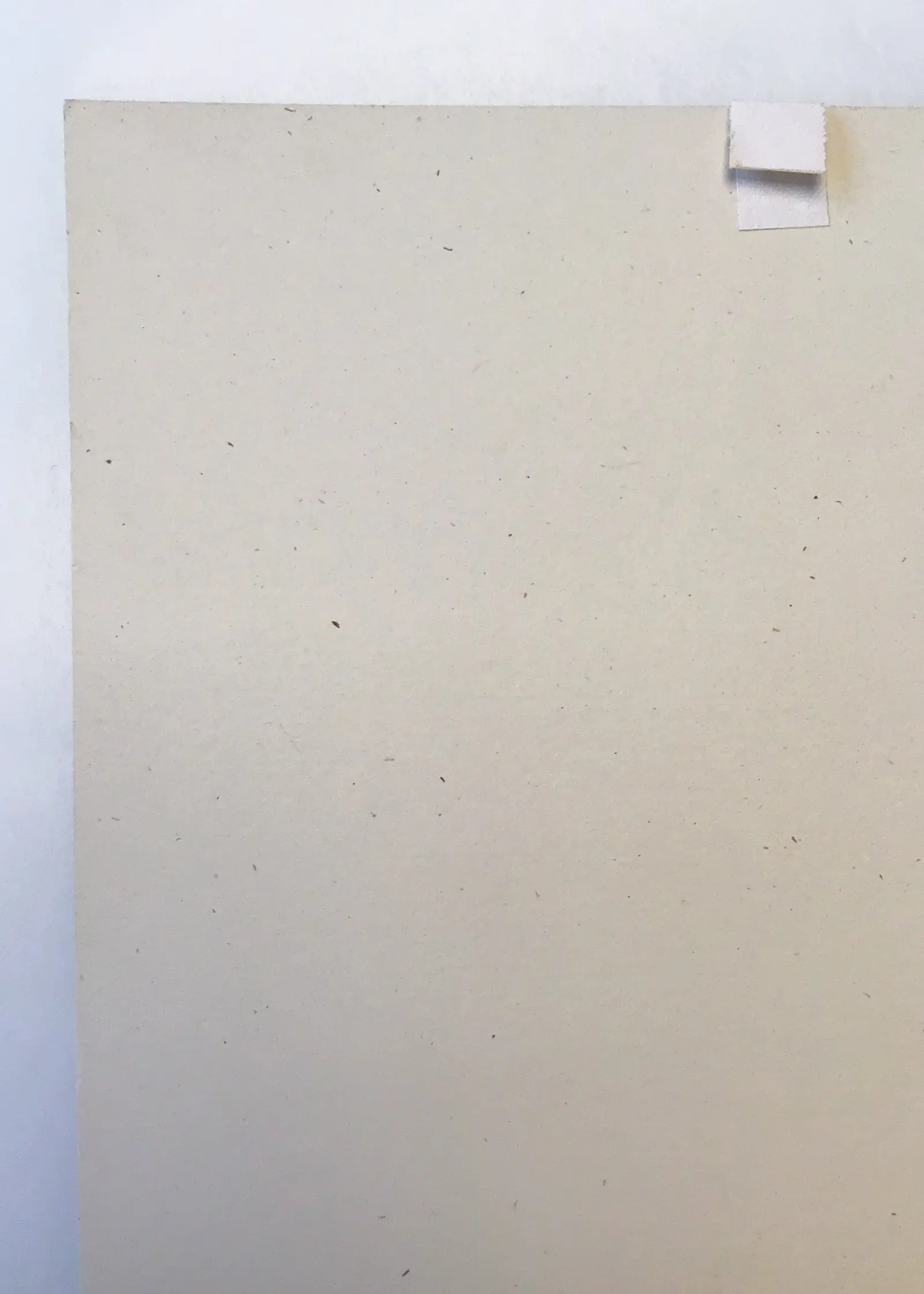 An example of a Banksy print that has been previously window mounted showing the signs of uneven light exposure on the front and tape on the back.