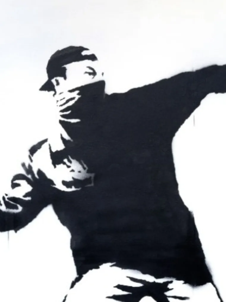 A Life Size example of Banksy’s Love Is In The Air Headlined Sotheby’s Evening Sale