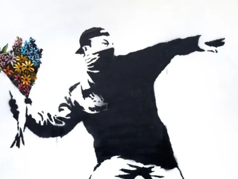 A Life Size example of Banksy’s Love Is In The Air Headlined Sotheby’s Evening Sale
