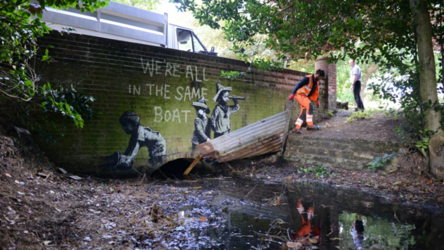 A worker removing the scrap metal "boat" in the piece in Nicholas Everitt Park.