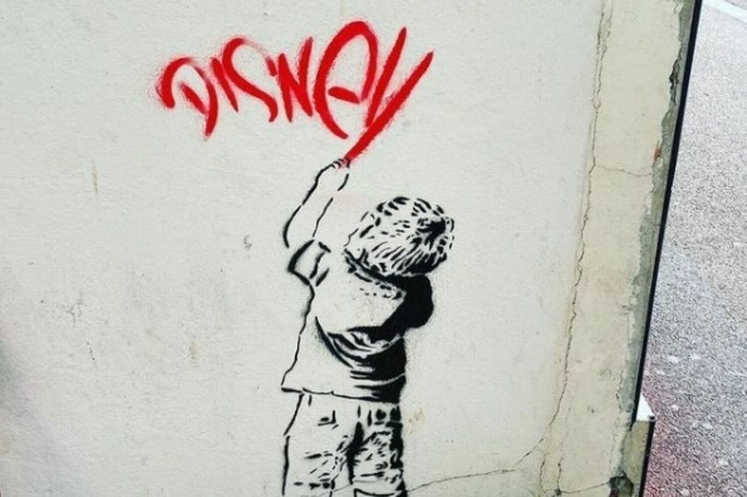Identify the piece that is not a Banksy.