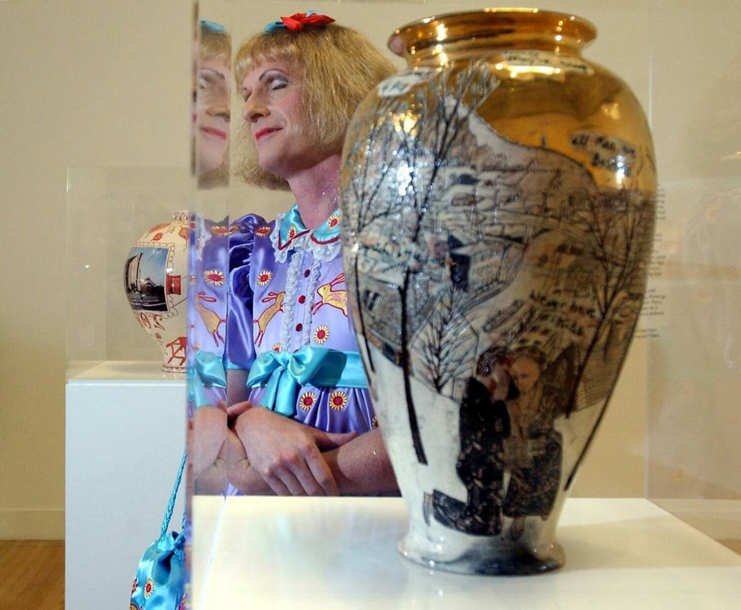 2003 Turner Prize winner Grayson Perry with one of his vases.