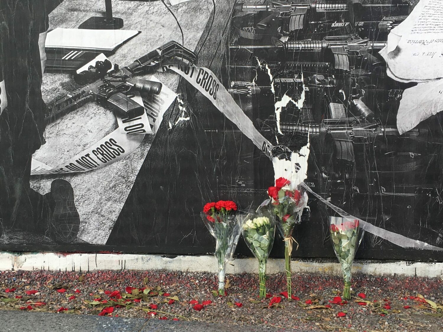 Flowers appear at the Bowery wall mural in Houston.