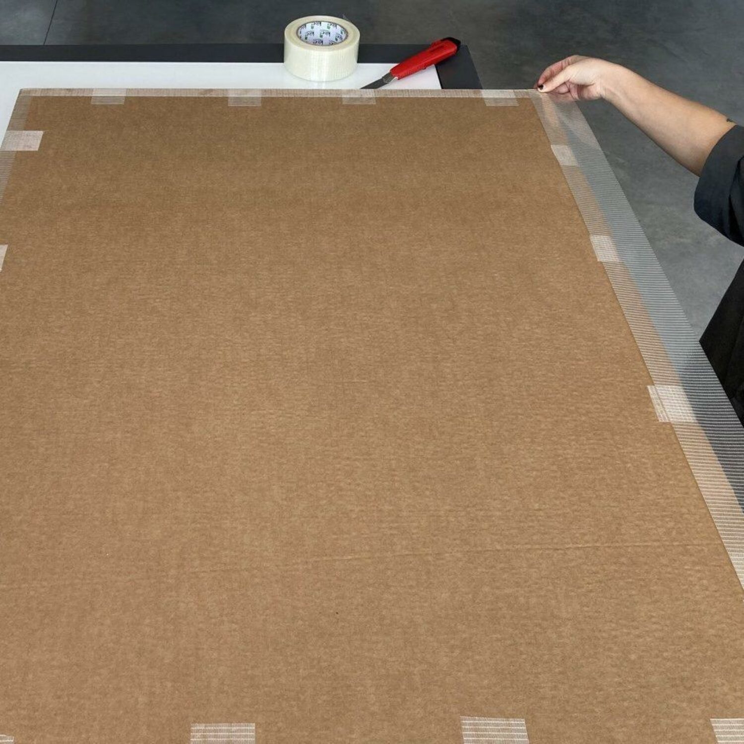 11. Using heavy duty tape, start taping up your flat pack making sure to use small pieces lengthwise and long pieces widthwise to completely seal off any gaps.