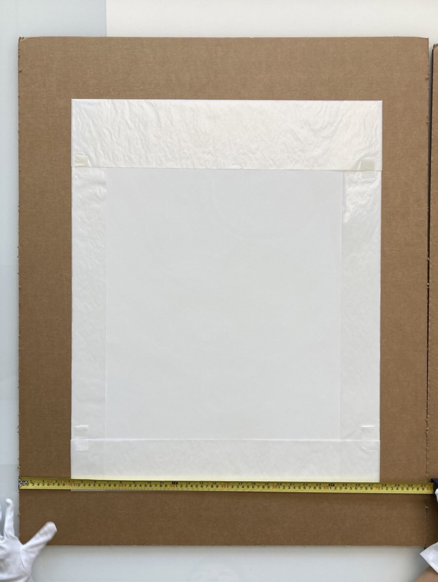 2. Choose a flat pack (again this can be cardboard, triwall, quadwall or MDF depending on where your artwork is going) that leaves a 5 to 10 cm border once the print is placed in the middle.