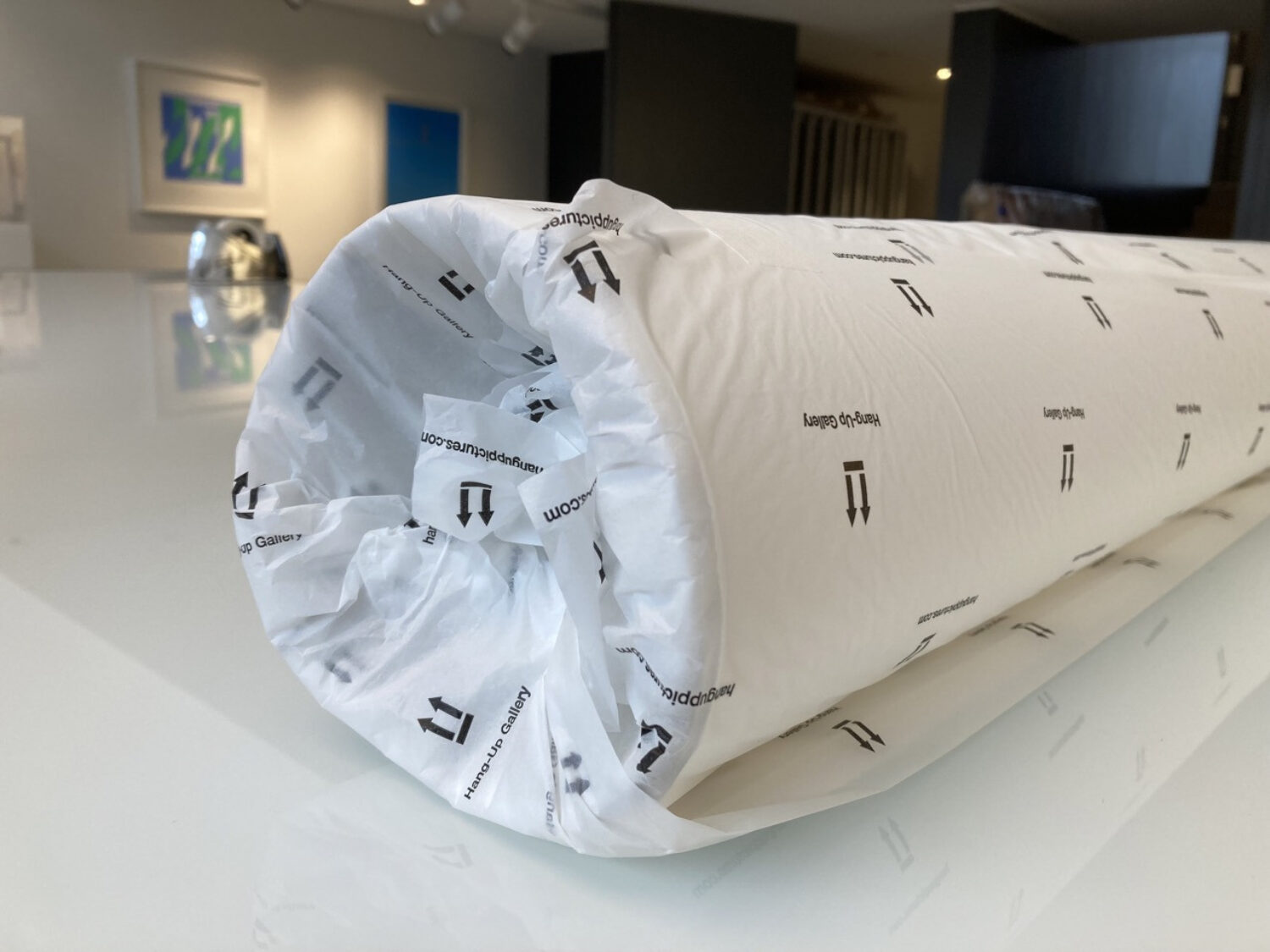 8. Now tuck in the sides of the tissue paper into your print, starting with the inner most piece and working your way outwards.