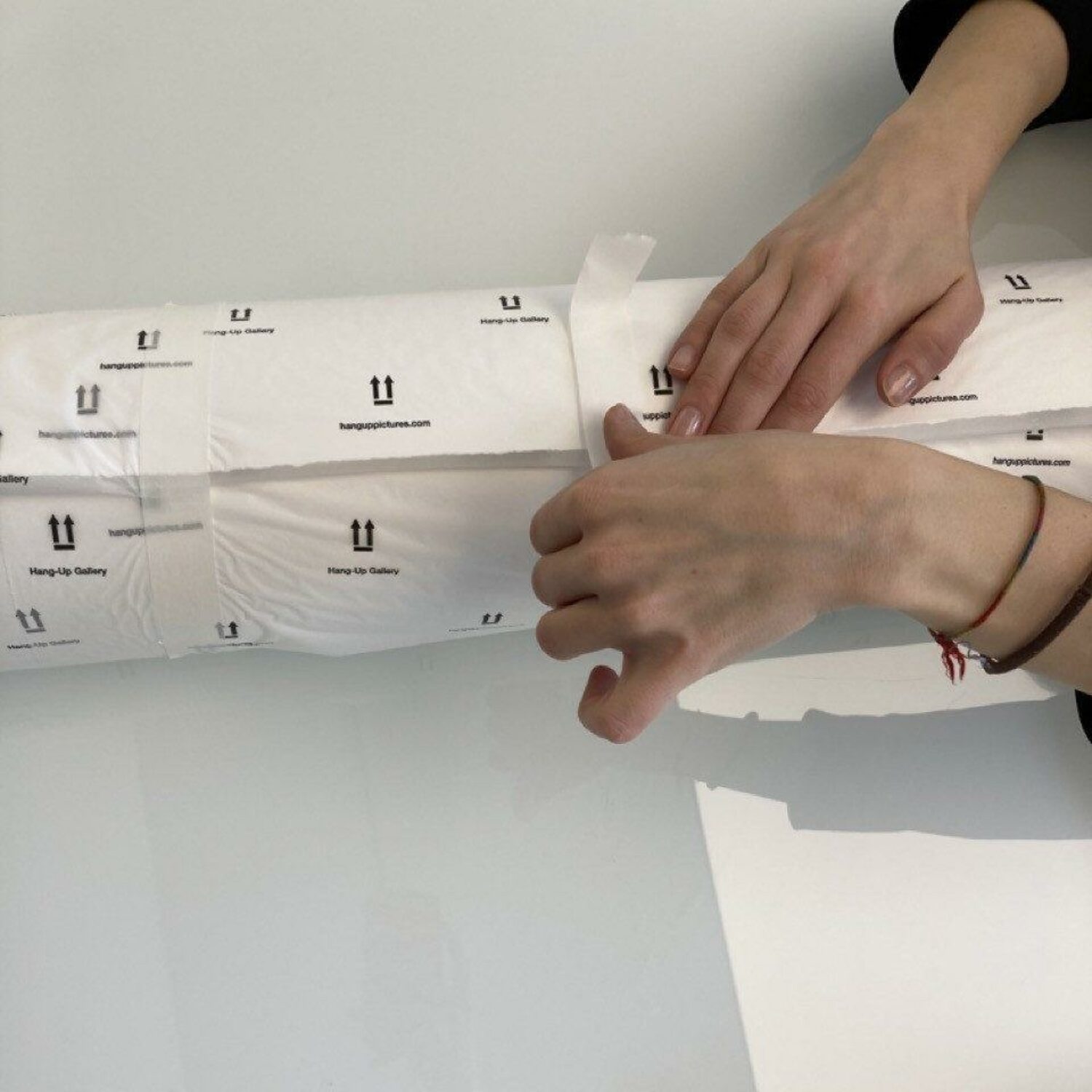 7. Once your print is rolled, tape the rolled edge with enough masking tape to ensure it doesn’t come undone.