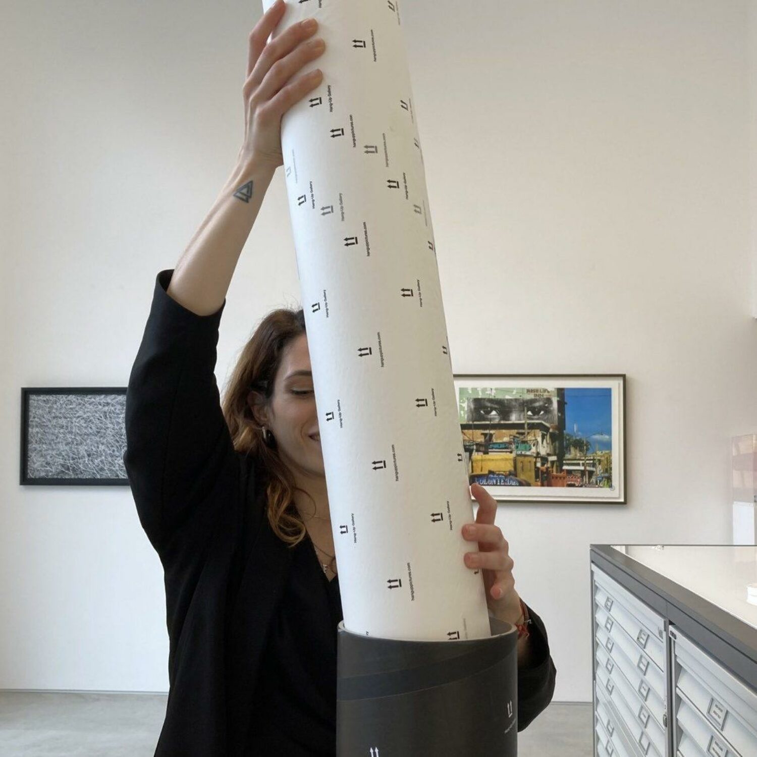 10. Put another piece of tissue paper or bubble wrap on top of your print inside the tube and seal the top of your tube with heavy duty tape.