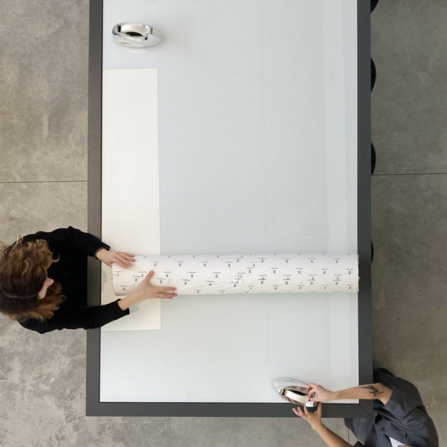 7. Once your print is rolled, tape the rolled edge with enough masking tape to ensure it doesn’t come undone.