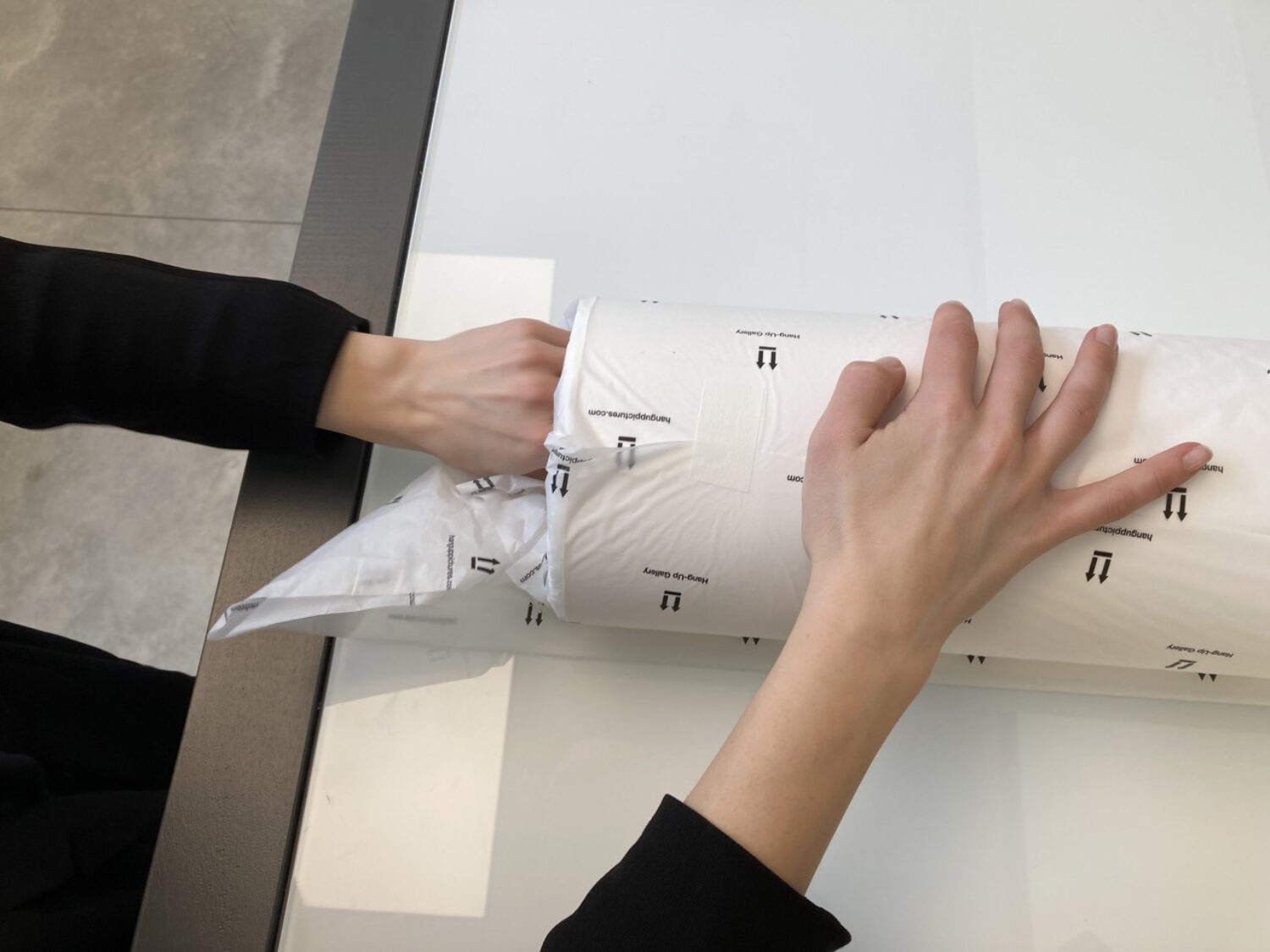 8. Now tuck in the sides of the tissue paper into your print, starting with the inner most piece and working your way outwards.