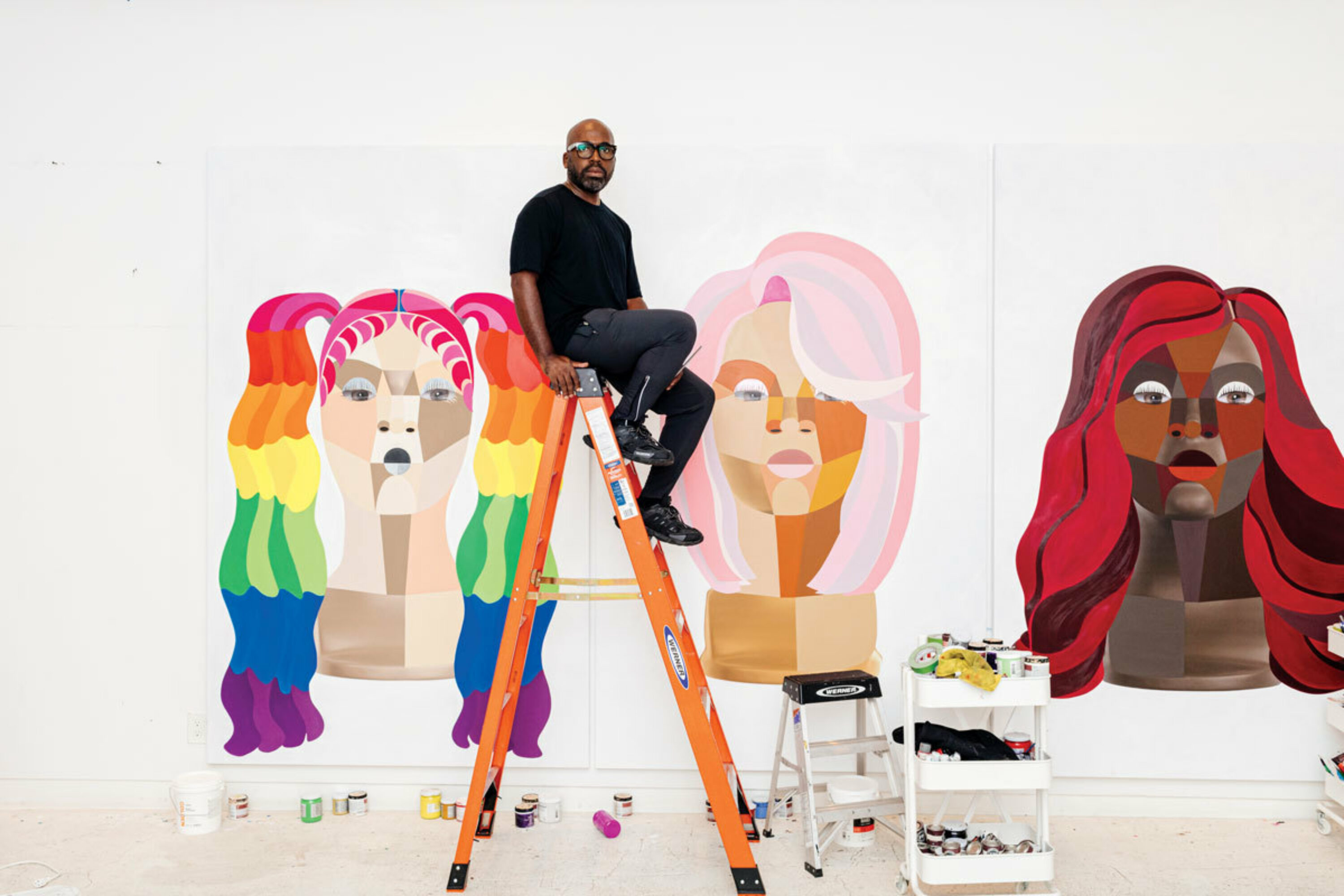 Derrick Adams in his Brooklyn studio with works from his 'Style Variations' series.