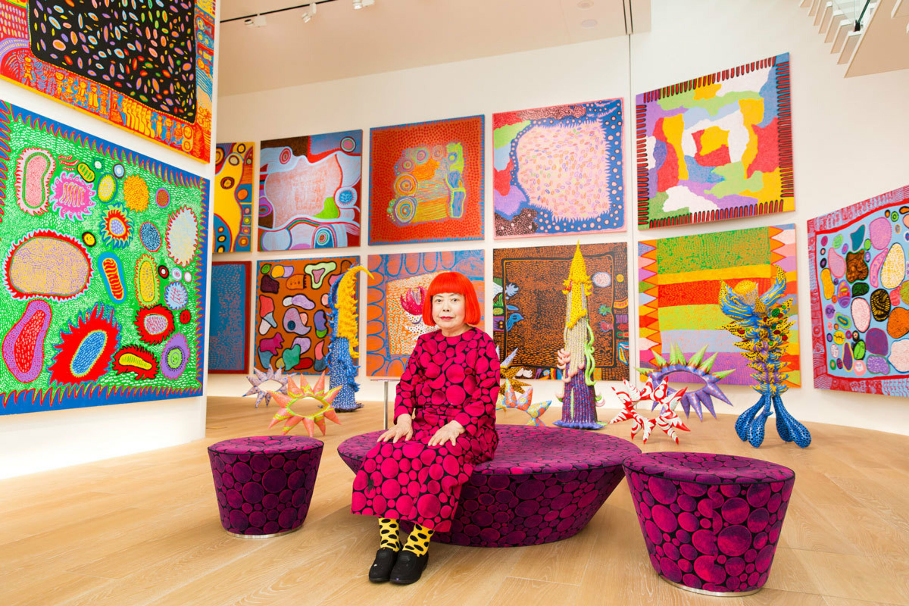 Yayoi Kusama surrounded by her work in Tokyo, 2016.