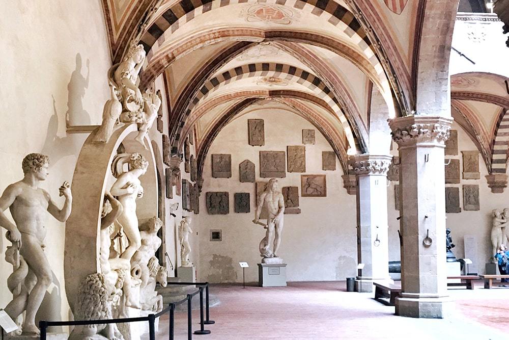 The courtyard of the Bargello Museum and the interior of Casa Buonarroti, Florence.