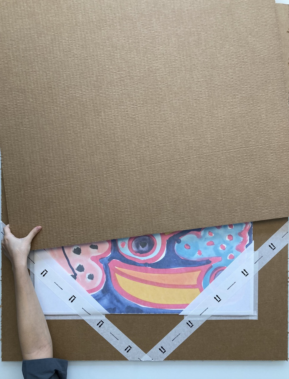 10. Place the other flat pack board on top of your print, sandwiching the artwork in the middle.