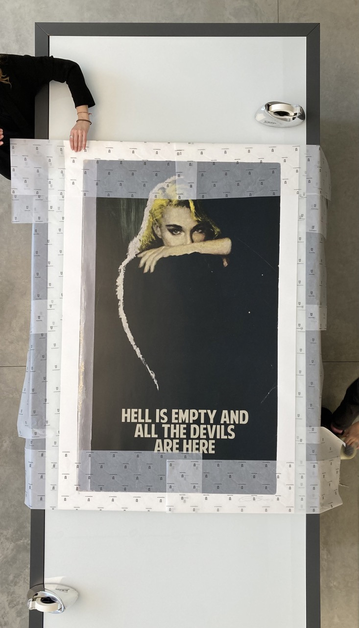 5. Start by folding in the top and bottom of the tissue paper over the top and bottom of your print, leaving the sides unfolded.